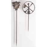 A silver hole in one golfing pin, and a silver shield finial cricketing pin.