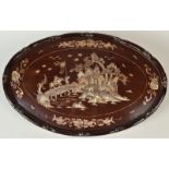 A Chinese hardwood oval plaque,