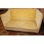 A late 19th century two seat sofa upholstered in buttoned yellow draylon, width 127cm.