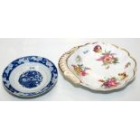 A Spode shell shaped dish painted with three botanical groups and scattered flowers,