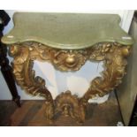 A small Italian 18th century Rococo carved and gilt console table with later marble top,