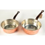 Two heavy copper Windsor pattern pans with iron handles, the interiors recently re-tinned.