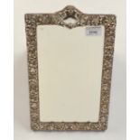 A late Victorian, ornate silver mounted dressing table mirror, 35 x 22cm.
