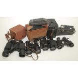 Various cameras and binoculars, together with a laboratory balance.