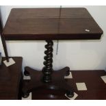 A Victorian rosewood occasional table with tapering spiral pedestal.