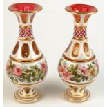 A pair of good Bohemian cranberry glass white overlay vases,