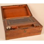 A Victorian walnut veneered writing slope with brass corners.