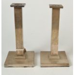 A pair of Art Deco plain, square section candlesticks.