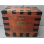 A metal bound oak silver chest with iron carrying handles and a brass name plate inscribed Revd I.T.