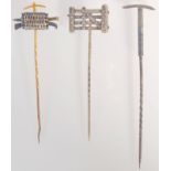 A silver four bar field gate pin, an ice pick silver pin and a silver and gold pin,