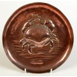 A Newlyn copper tray with a large central crab impressed mark, diameter 21.7cm.