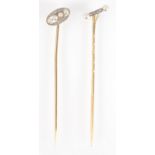 Two Belle Epoque pearl and diamond set pins, one 18ct.
