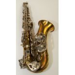 An Evette Schaeffer, Paris, brass and nickel alto saxophone in a black rexine case.