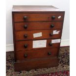 A mahogany collectors chest of five long graduated drawers, width 44cm, height 66cm.