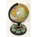 A 1950s tinplate globe, height 20cm.