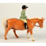 A Beswick model boy on a pony.