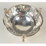 A pierced hexafoil bonbon dish by Mappin and Webb on three cast supports.