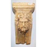 A plaster mask moulded corbel.