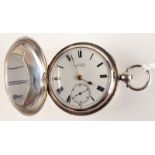 A good large silver full hunter cased pocket watch with an applied gold garter,