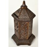 A cast iron hexagonal money bank, registration No. 187026.