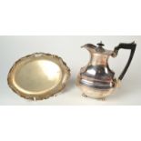 A coffee pot with an ebony handle and an oval pierced dish.