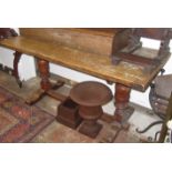 An oak refectory dining table in Tudor style with turned supports and low stretcher, 74 x 160cm.