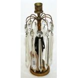 A Regency bronze and brass candlestick, the classical female figure surrounded by cut glass drops.
