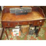 A Regency mahogany bowfront washstand with a plain three quarter gallery on turned legs.