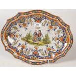 A French country pottery tray, the centre with figures in a landscape,