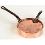 A tinned heavy copper shallow pan with iron handle, the lid with Victorian inventory mark.