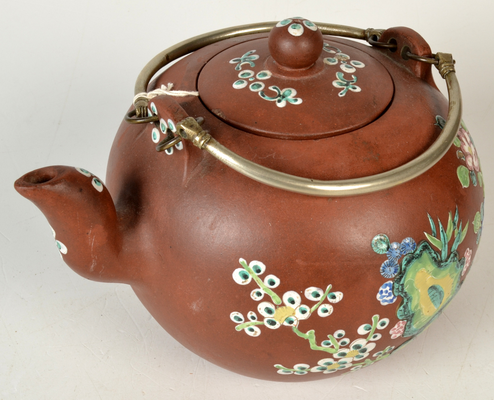 A Chinese Yixing teapot, with a pair of white metal handles, the body,