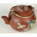 A Chinese Yixing teapot, with a pair of white metal handles, the body,