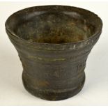 A 17th century bronze mortar of bell shape, dated 1685 and initialled H.I.A., height 12.