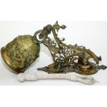 An ornate cast brass bell with bracket and pull.