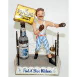 Pabst Beers, a 1960s die cast bar sign made as a boxer in a ring with a bottle of Blue Ribbon beer,