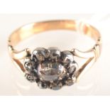 An antique diamond cluster ring. Condition Report: Ring size O.