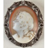 A carved hard stone cameo with the head of a young lady in silver brooch mount.