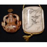 A Japanese four sectional bone inro, one side decorated with an erotic scene,