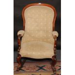 A Victorian mahogany spoon back gentleman's armchair,