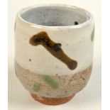 A Bill Marshall stoneware yunomi, splashed with green and tenmoku, potters seal, height 10cm.