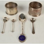 Two napkin rings, a souvenir spoon and three condiment spoons.