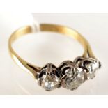 An 18ct. gold three stone diamond ring.