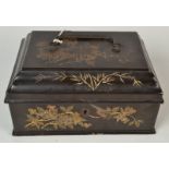 A Chinese black lacquered work box, the hinged cover surmounted by a metal handle,