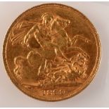 A Victorian old head sovereign dated 1899, good, very fine.