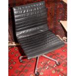 Charles Eames office thin pad ribbed black leather chair on aluminium base.