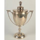 A twin handle lidded silver trophy, 21oz.