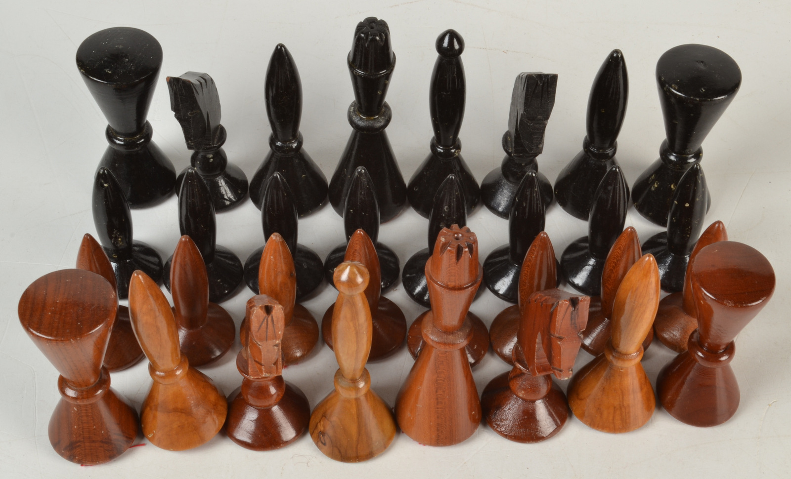 A 1970s/80s turned and carved wood chess set. Condition Report: King is 10cm.