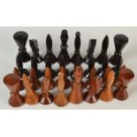 A 1970s/80s turned and carved wood chess set. Condition Report: King is 10cm.