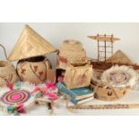 A collection of baskets, a model outrigger canoe,