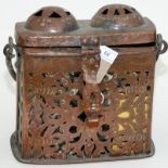 A Dutch two section pierced copper case, the hinged lid with two domed sections, iron swing handle,